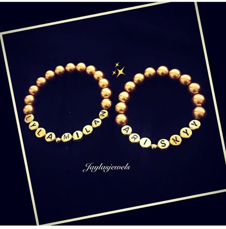 Image of Gold or silver name bracelet