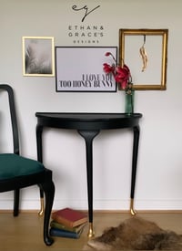 Image 1 of Black half moon with gold leaf feet.