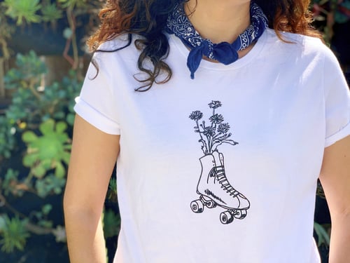 Image of ROLLER SKATE FLOWER WOMAN'S TEE / COLLAB WITH COAST MODERN - WHITE