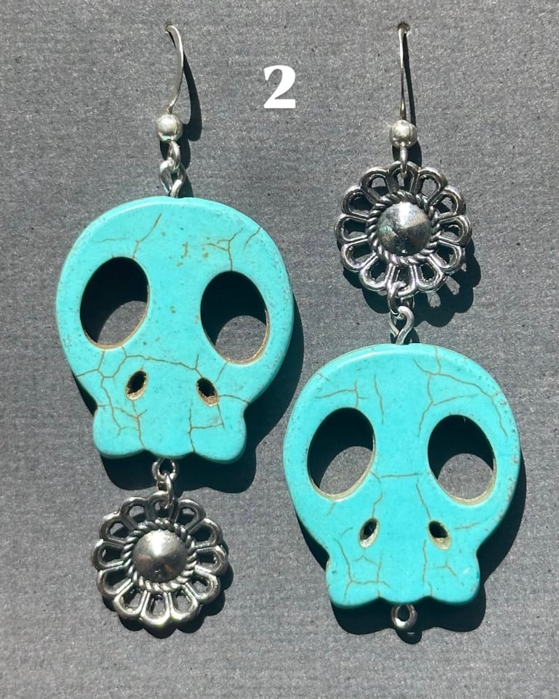 Image of blue skull earrings