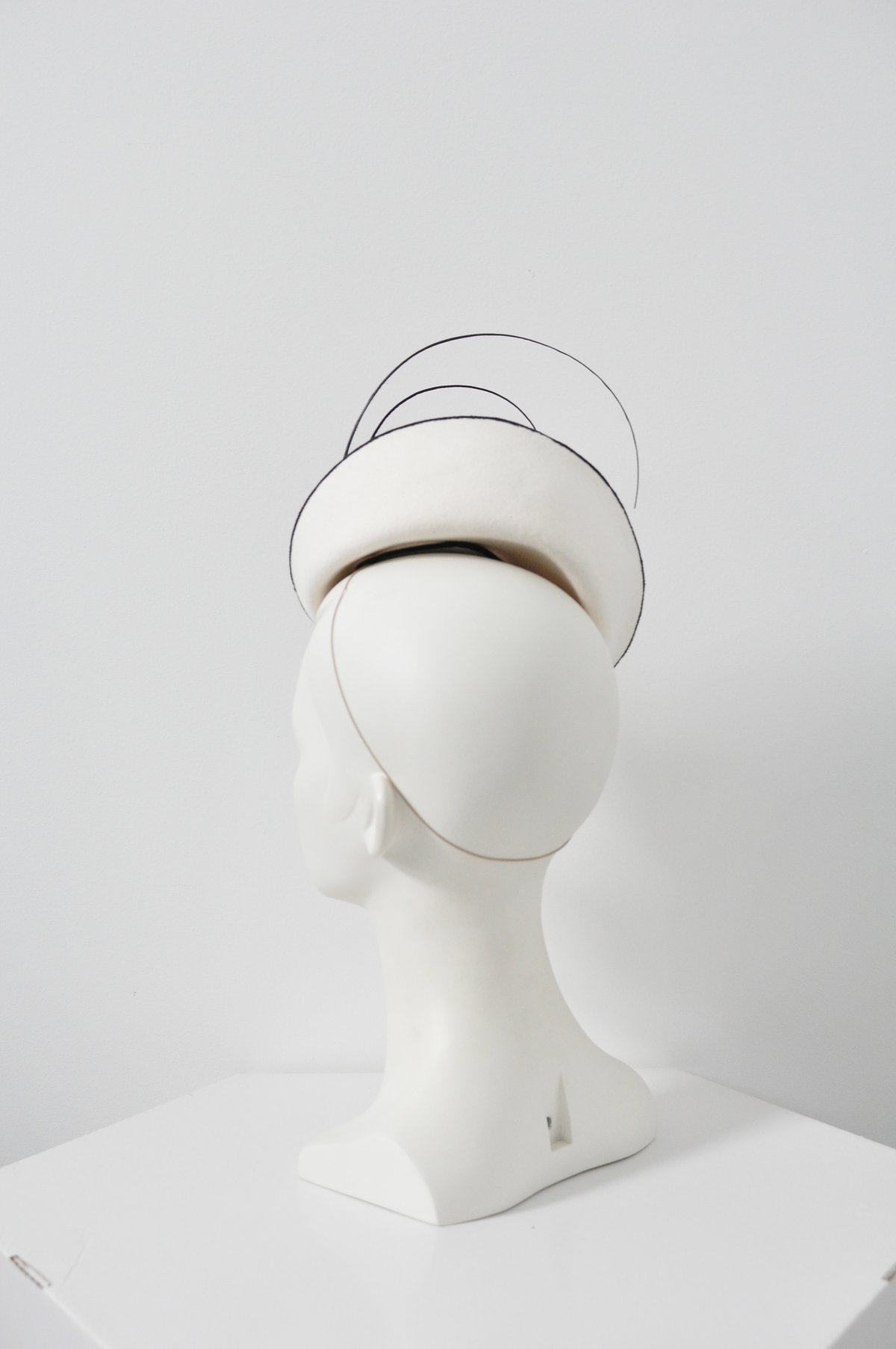 Image of felt headpiece with quills