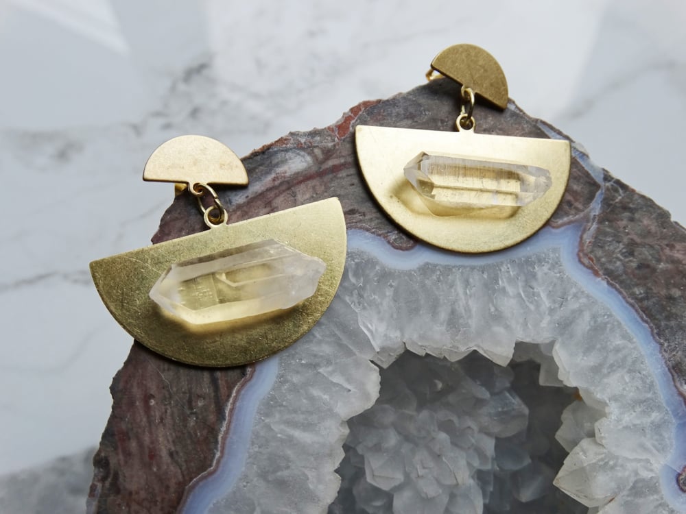 Image of brass half moons + quartz