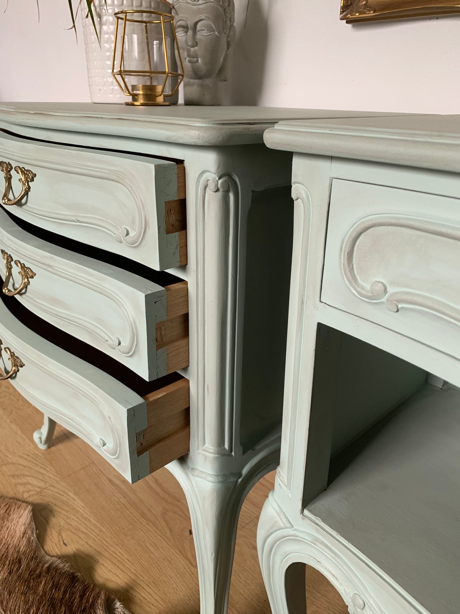 Image of French wooden bedside tables in a pale green with dark wax