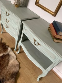 Image 3 of French wooden bedside tables in a pale green with dark wax