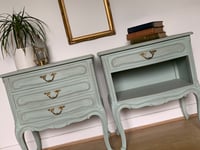 Image 2 of French wooden bedside tables in a pale green with dark wax