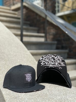 Leave Your Mark Shop Snap Back Hand Style Hat 