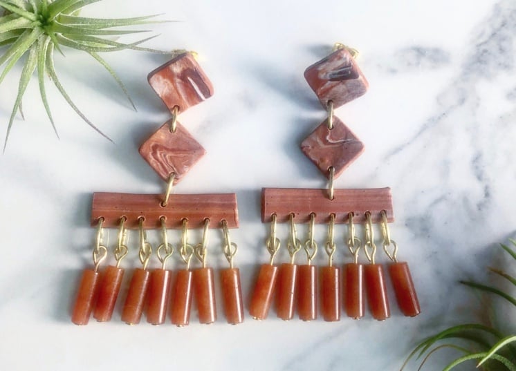 Image of mars-marbled clay + agate tassels + brass