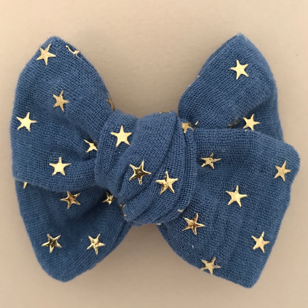 Image of Barrette double gaze bleue étoiles dorées