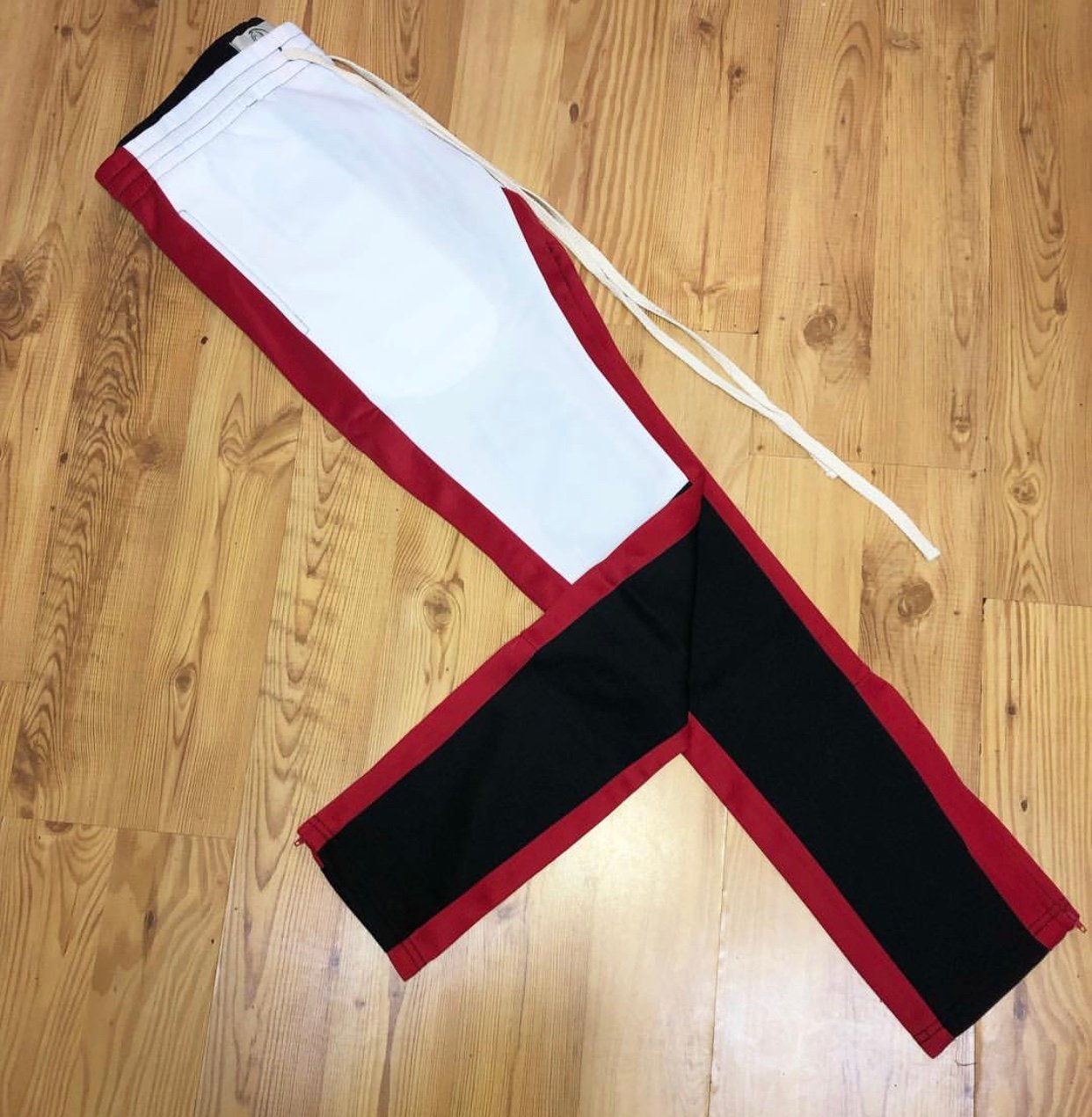 red black and white track pants