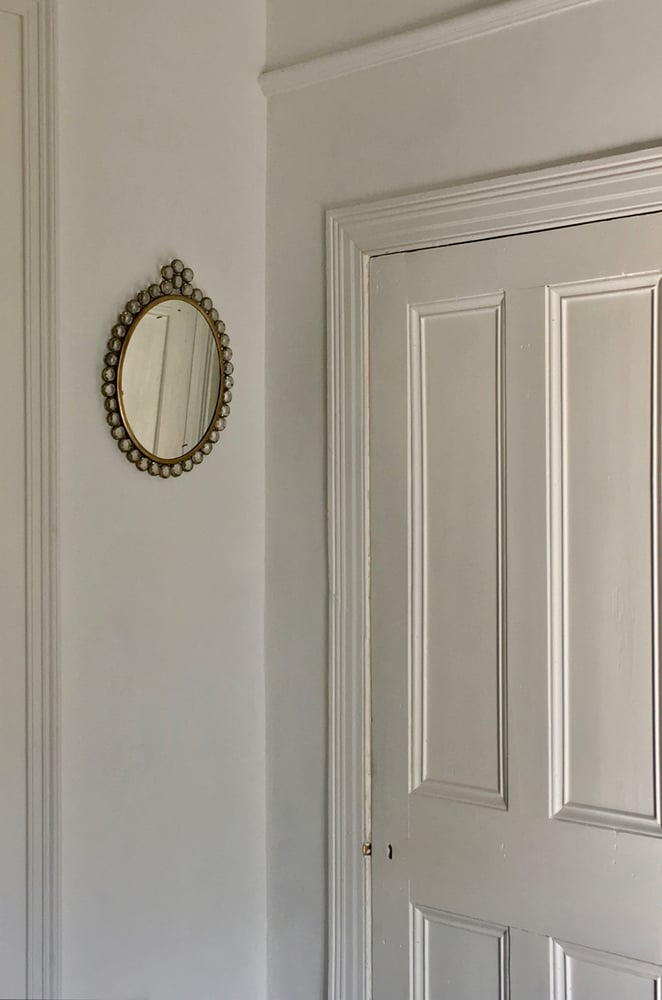 Image of Small Wall-Mounted Mirror with Decorative Frame