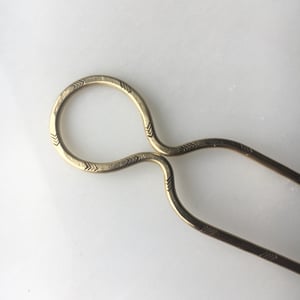 Image of stamped loop hair pin 