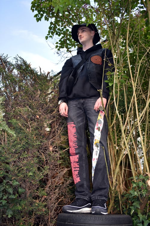 Image of 'What's it all worth?' Custom black Levi's