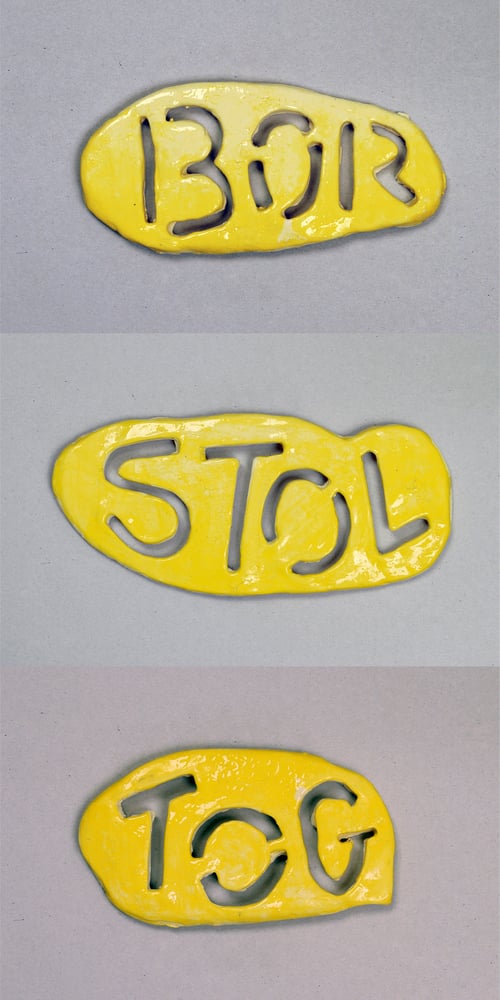 Image of Yellow Ceramic Word