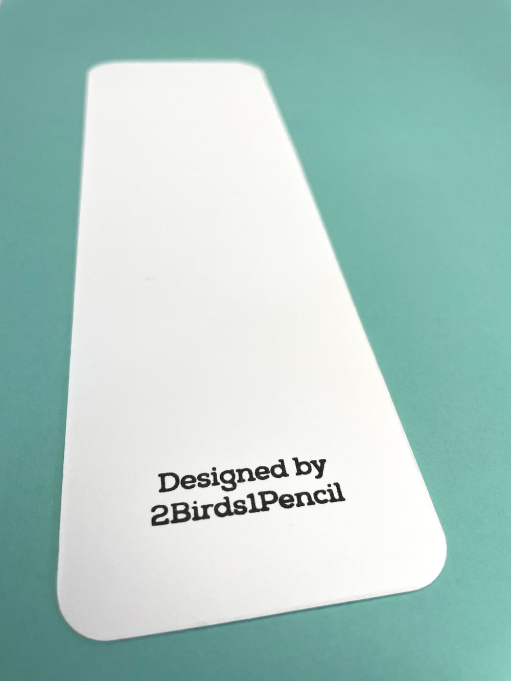 Image of Reading raccoon bookmark
