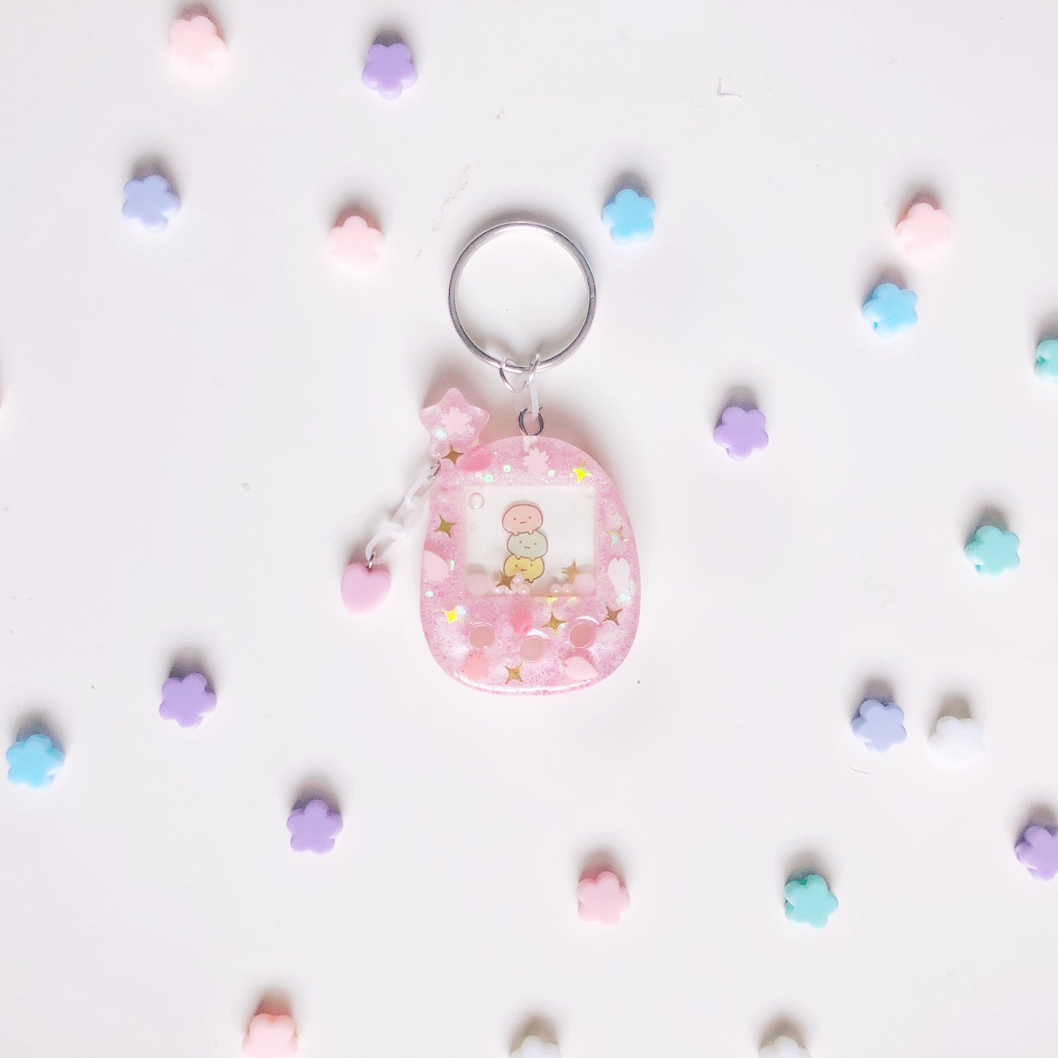 Image of small size pink tamagotchi type keychain 