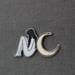 Image of Sun and Moon dual metal cloisonné pin