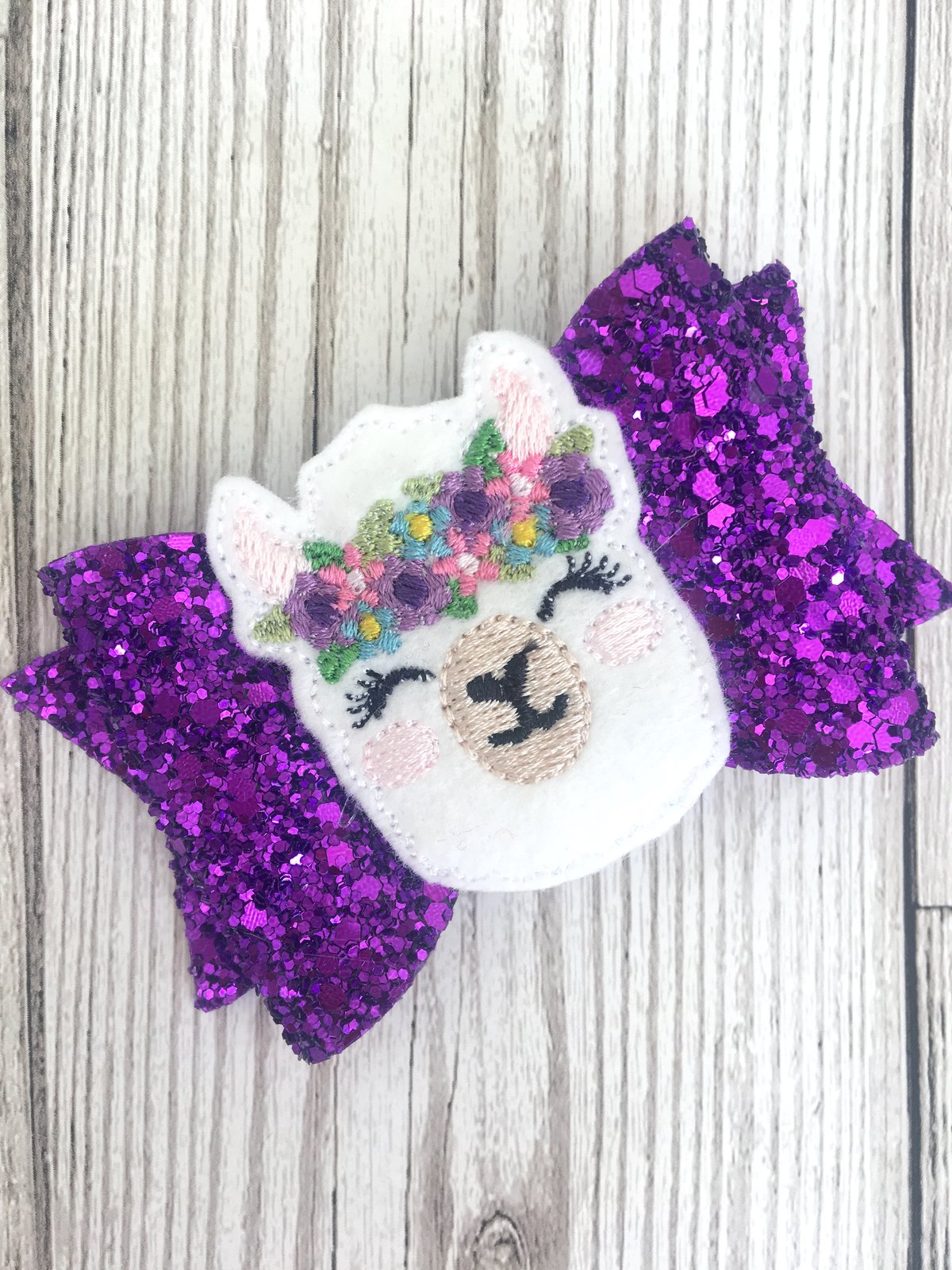 Image of Llama bow holder with matching bow 