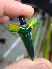 Image 2 of Fully uv reactive crushed opal glass shark tooth pendant. 