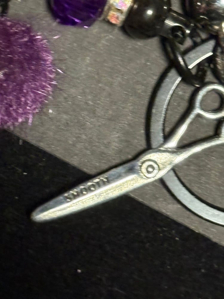 Image of hairstylist inspired black and purple purse clip keychain 