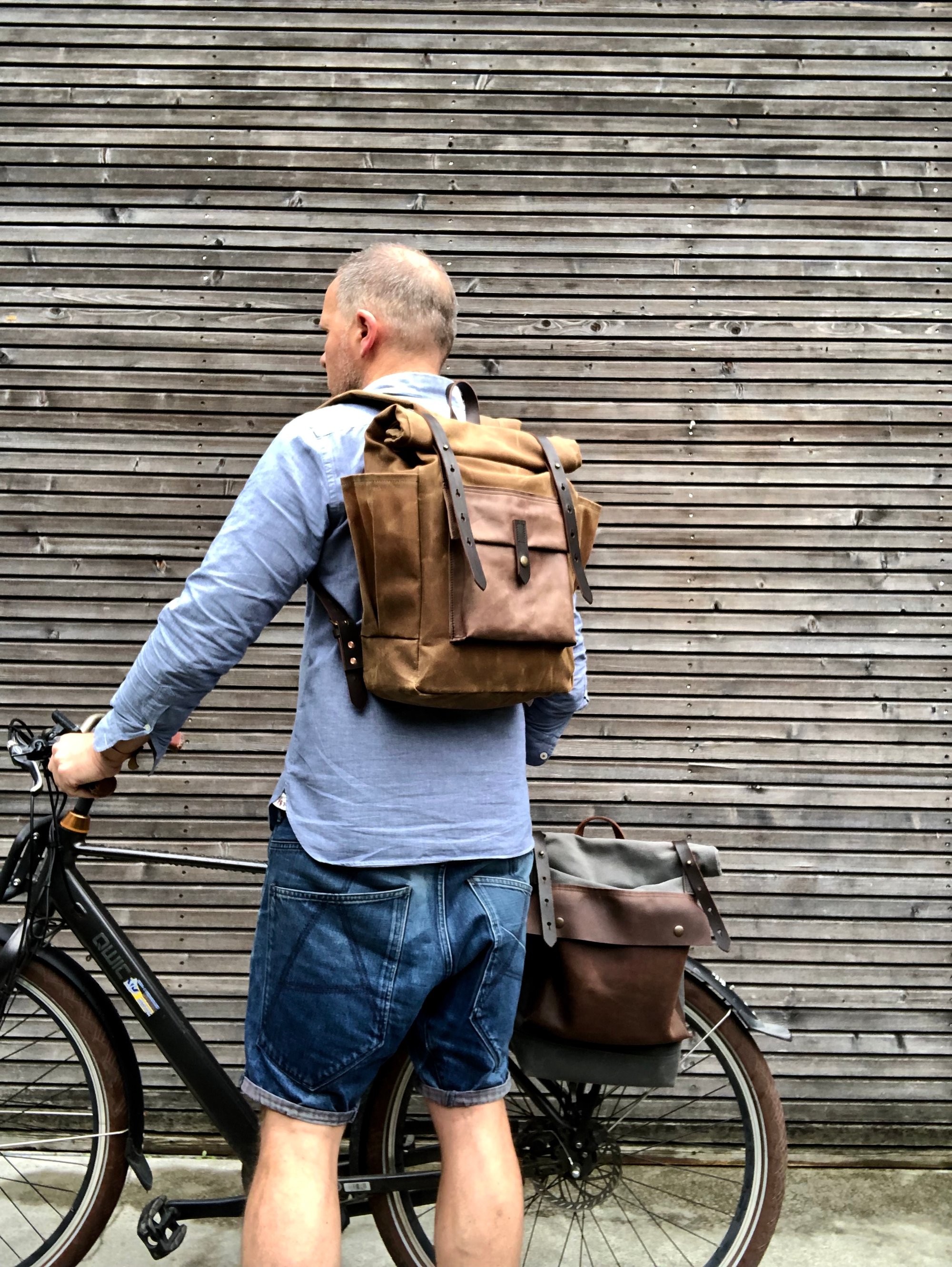 Waxed canvas backpack with roll up top and double bottle pocket COLLECTION UNISEX Treesizeverse