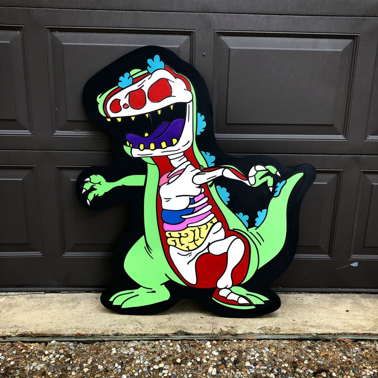 Image of Reptar dissected wood cut out 