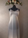 White tricot slip, style #11. Sizes 32"-38"