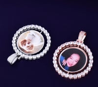 Rotating double sided circle pendant 