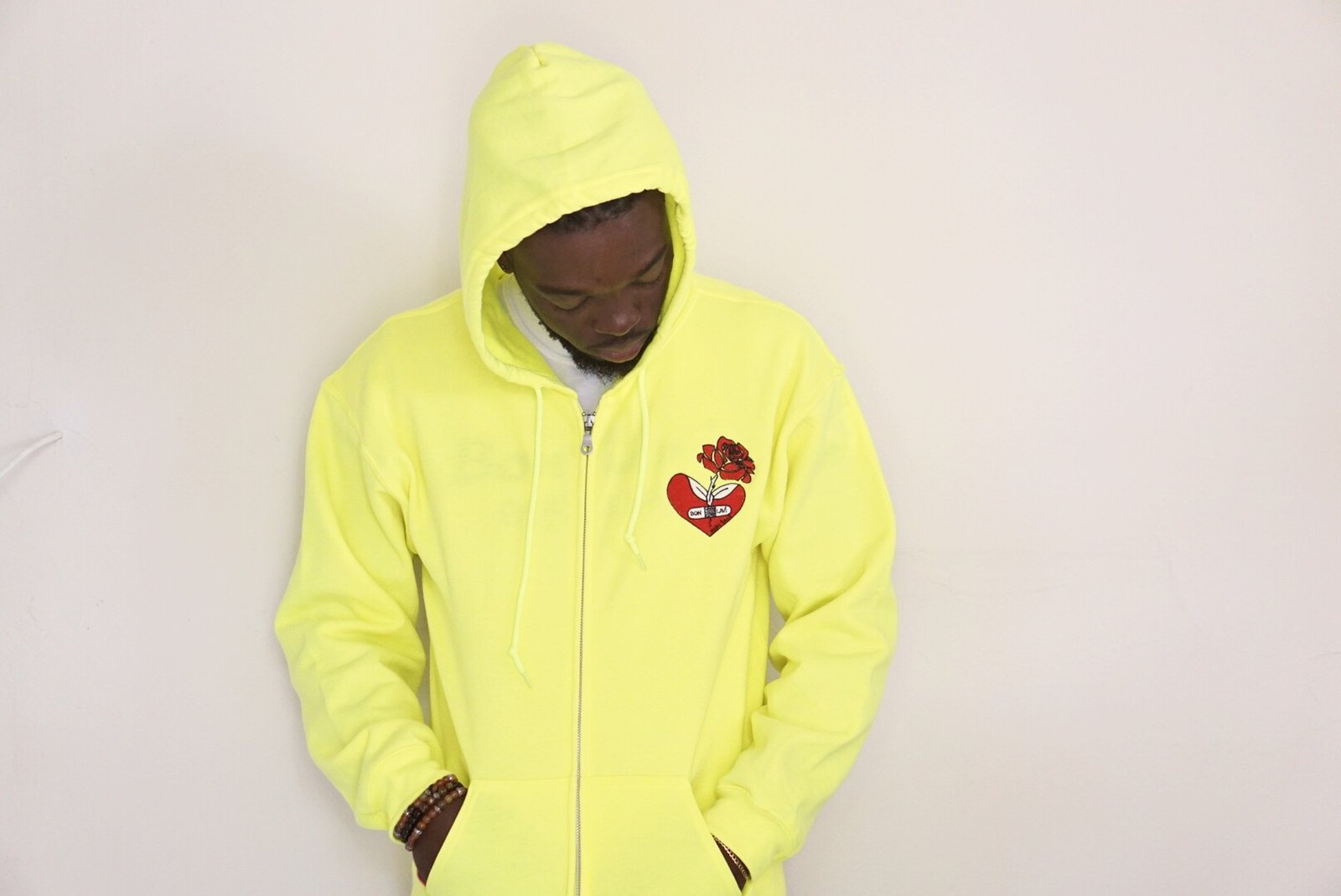 yellow hoodie with broken heart