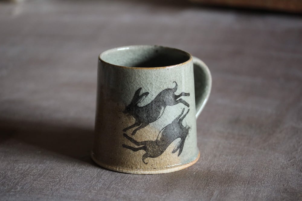 Hare and Rook Mug. Blue Celadon glaze. With Oxidized yellow limited edition 