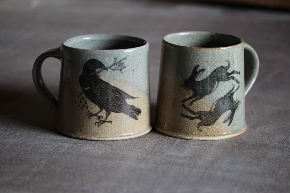 Hare and Rook Mug. Blue Celadon glaze. With Oxidized yellow limited edition 