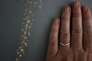 Image of 18ct gold white diamond set wishbone (chevron) ring