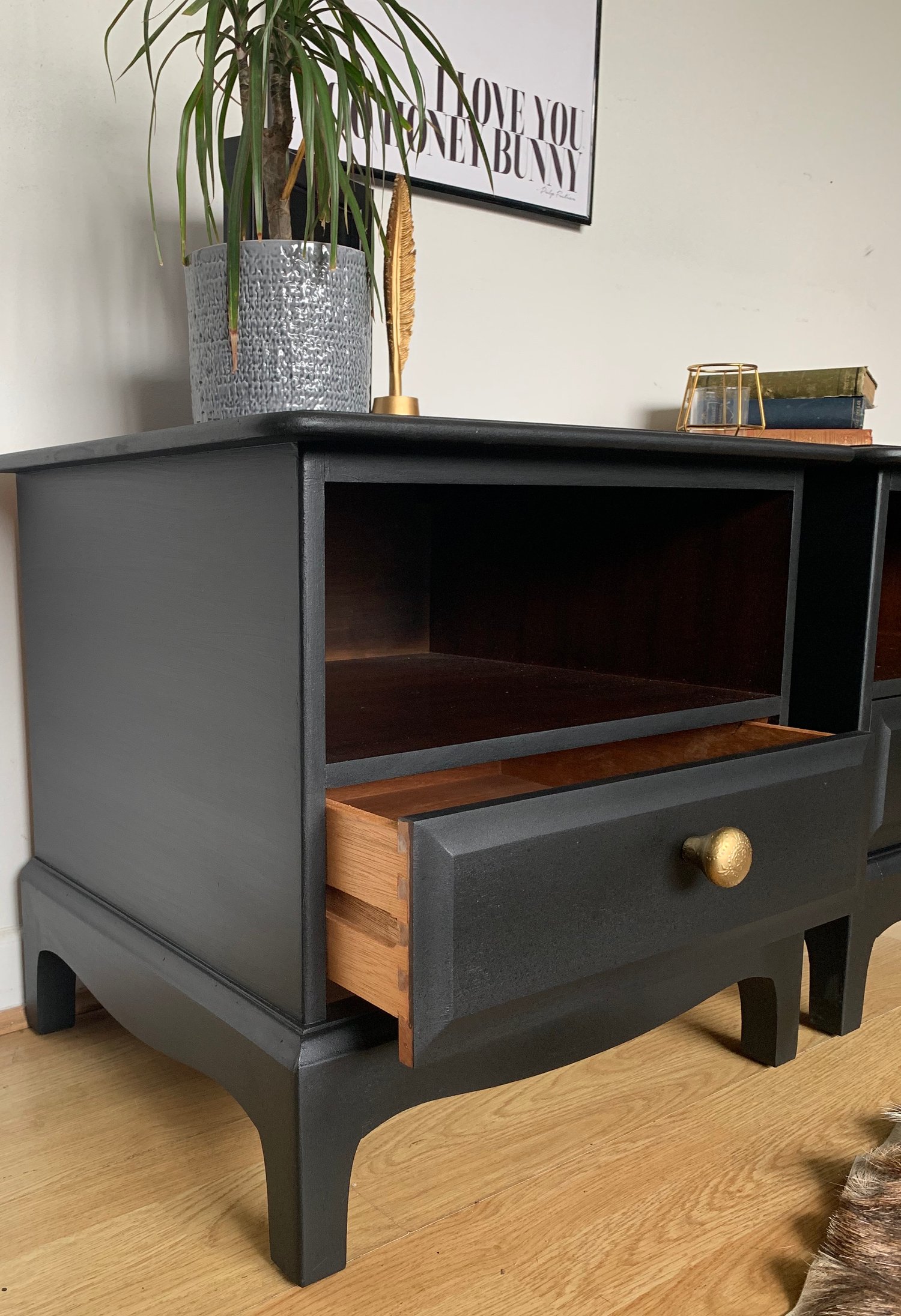 Image of ANY COLOUR A pair of black stag mahogany bedside tables.