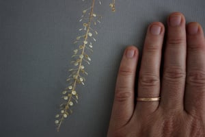 Image of 18ct rose gold, 2mm flat court, laurel leaf and milled edge engraved ring
