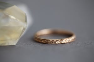 Image of 18ct rose gold, 2mm flat court, laurel leaf and milled edge engraved ring