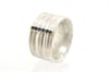 Wide band Strata ring set with sapphire. Sterling silver and 18ct gold