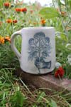 From the soil to the moon. Ceramic tankard. 