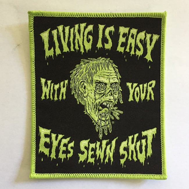 Image of Living is Easy with Your Eyes Sewn Shut Shrunken Head Woven Patch