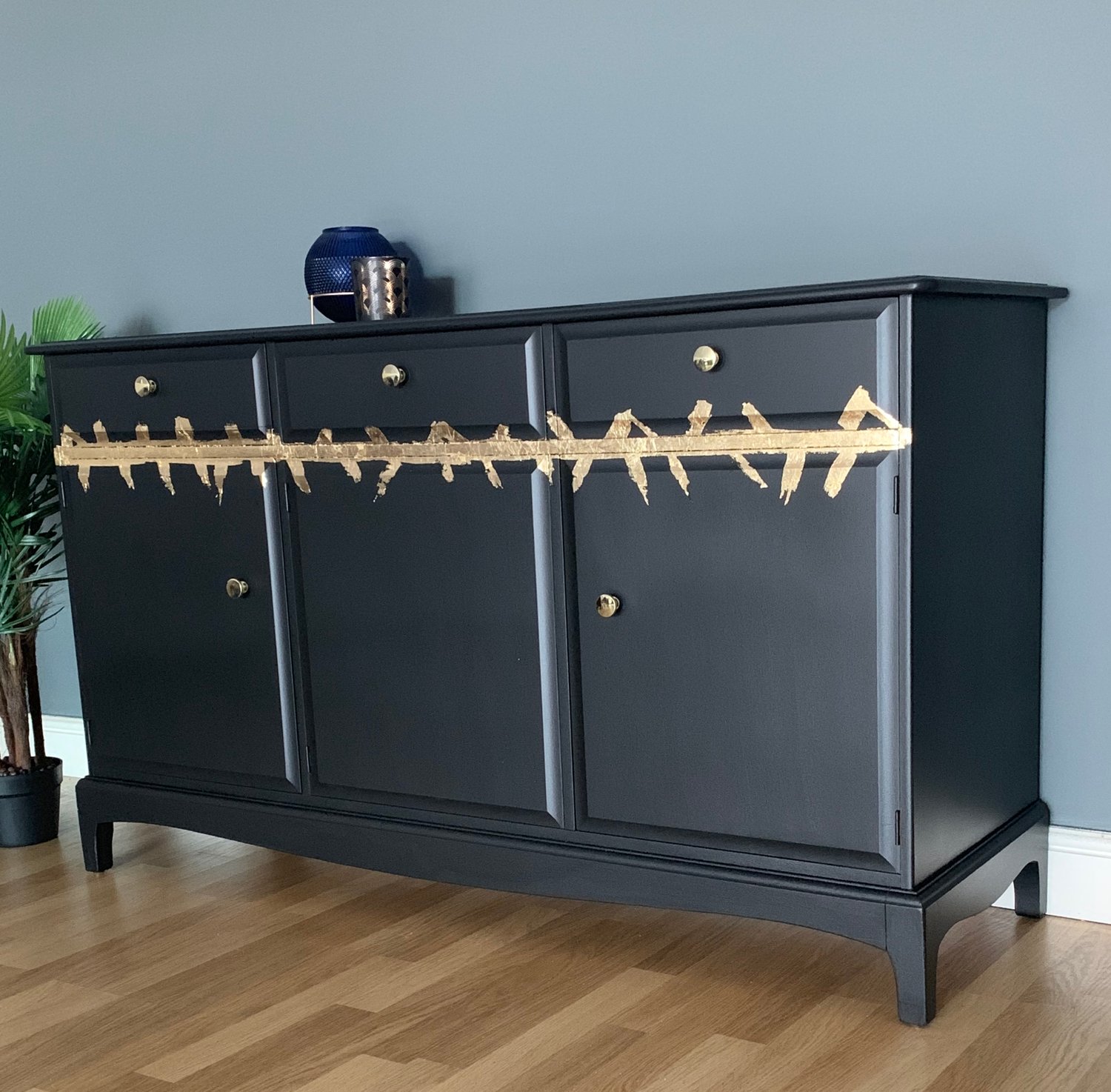 Image of A stunning black & gold leaf stag mahogany sideboard
