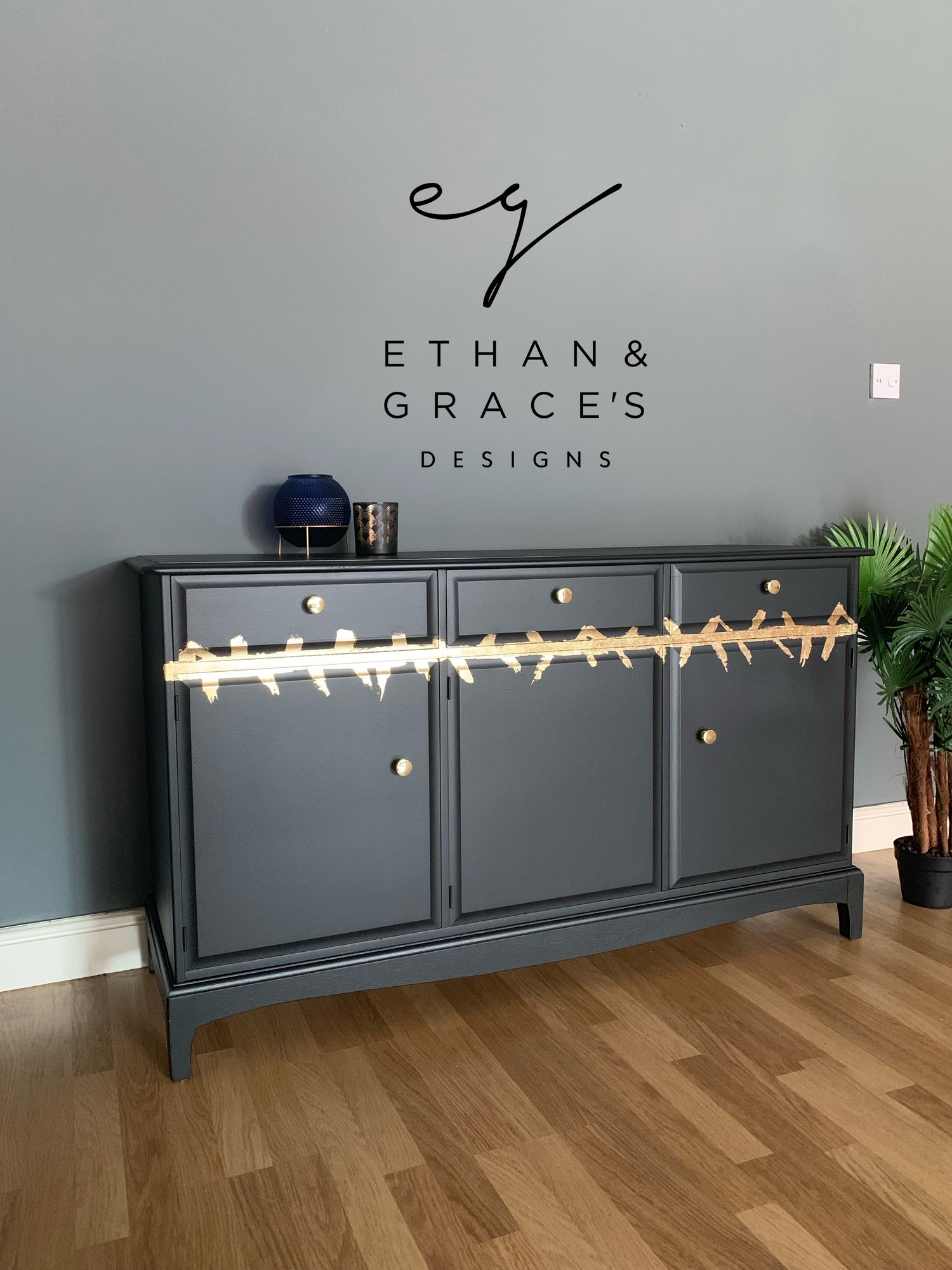 Image of A stunning stag black & gold leaf stag mahogany sideboard