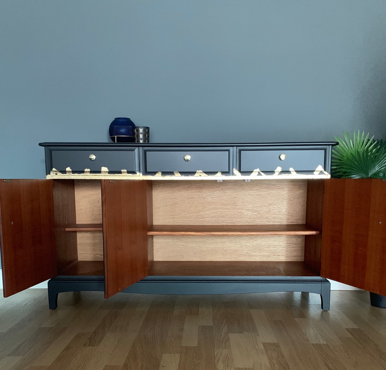 Image of A stunning stag black & gold leaf stag mahogany sideboard