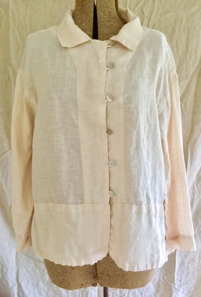 Image of fancy blouse in soft peach linen