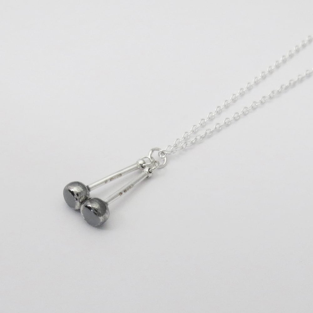 Image of Silver and Black Tenor Sticks Pendant