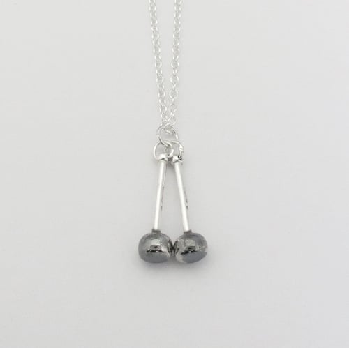 Image of Silver and Black Tenor Sticks Pendant
