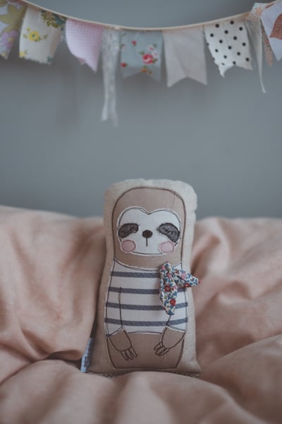 Image of Sloth in french stripe shirt and liberty neck tie