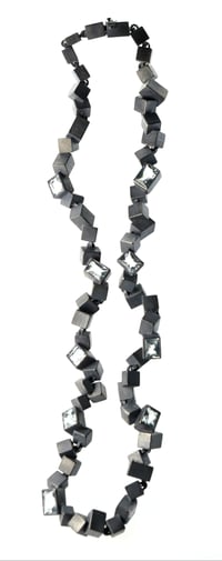 Image 2 of Intersecting Cube Necklace. Aquamarine set in oxidised silver