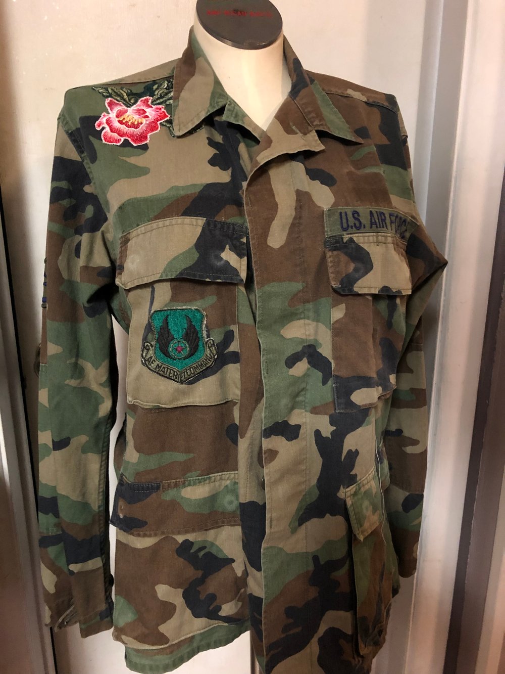 Camo jacket featuring custom stitched peony