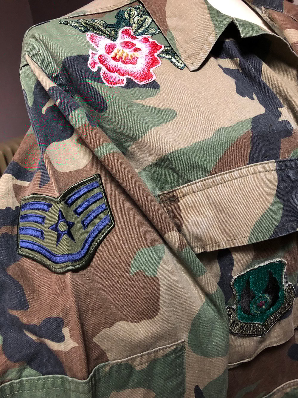 Camo jacket featuring custom stitched peony