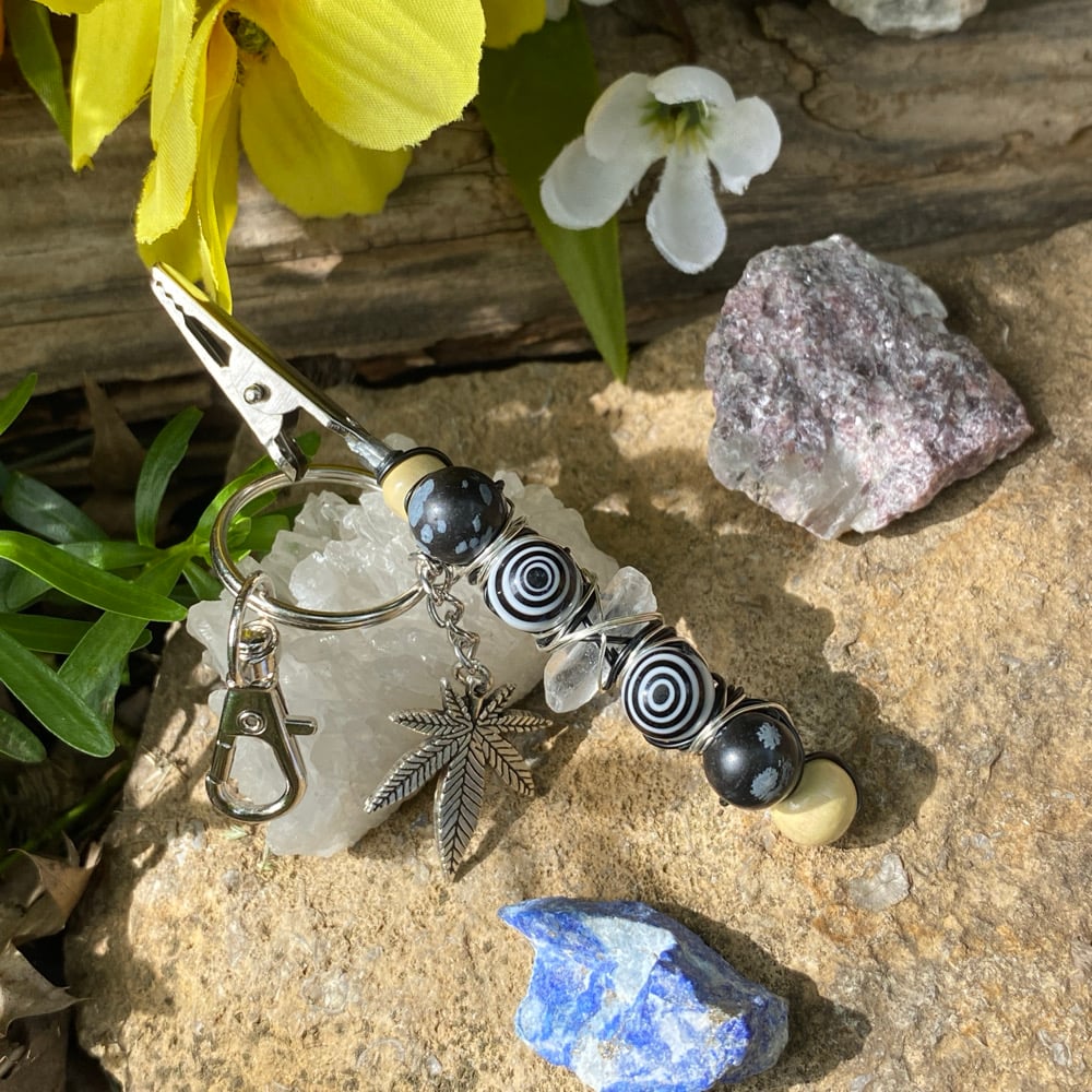Image of hypnotic moon clip keychain 