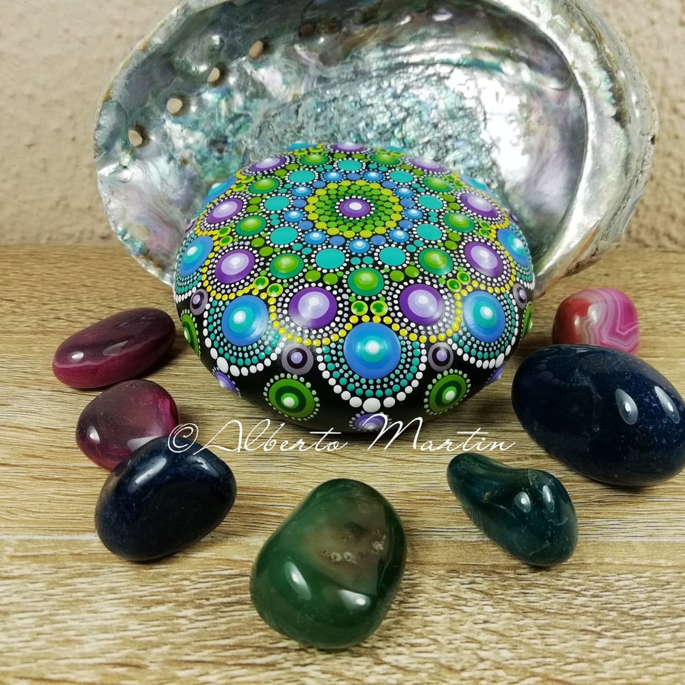 Image of Mandala painted stone. Purple, Blue and green.