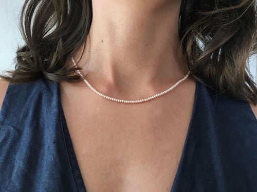 Image of "Now let the.." bead necklace from pearls · CANDIDA NUNC MOLLI.. ·